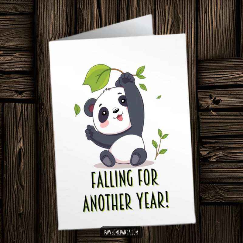 Funny Free Printable Birthday Card showing a panda reaching playfully for a single falling autumn leaf.