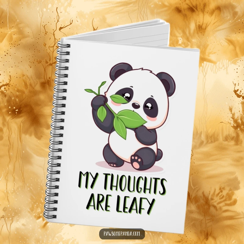 Funny panda playfully bamboozling a leaf on a notebook cover, perfect for journaling mischief.